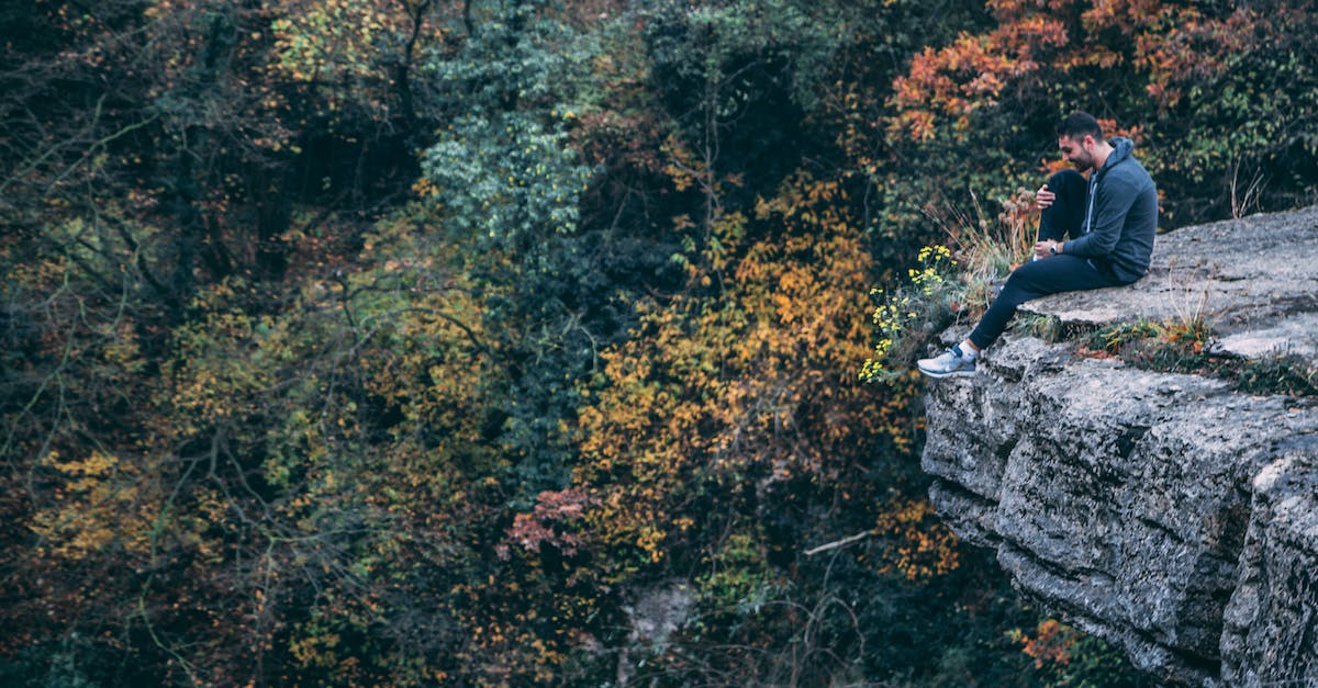 Is there any replay value in the Curse of Naxxramas solo adventure? - Man In Hoodie Sitting On Rock Cliff 