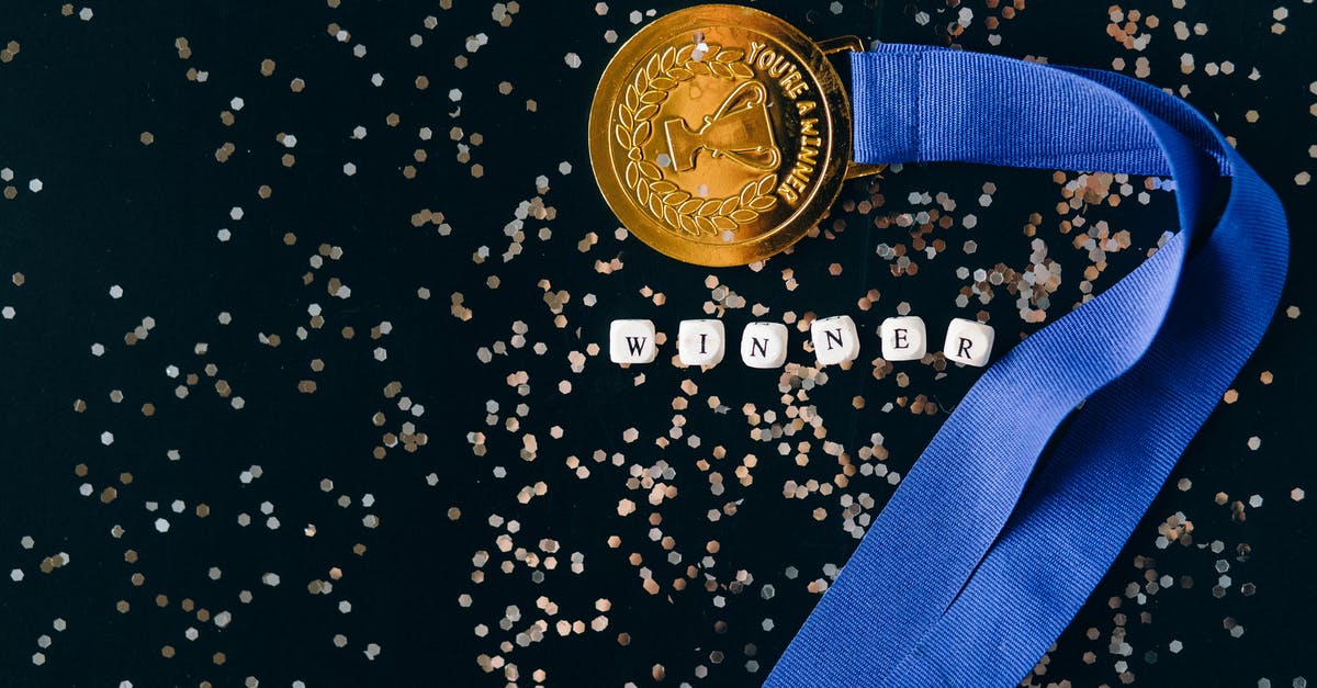 Is there any reward for completing rdr 2 missions with gold medal? - Close-Up Shot of a Gold Medal on a Black Surface