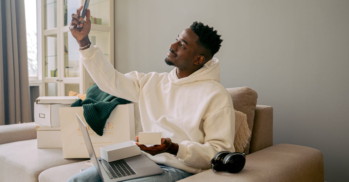 Is there any reward specific to Loot Boxes that cannot be obtained otherwise? - Man in White Sweater Sitting on Brown Sofa Chair