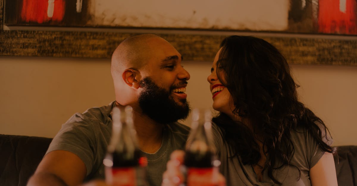 Is there any way in Tomodachi Life to force people to date? - Close-Up Photography of Couple Laughing