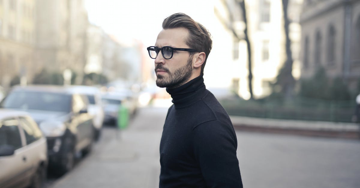 Is there any way to capture this specific city? - Man Standing on Street Is there any way to capture this specific city? - Man Standing on Street
