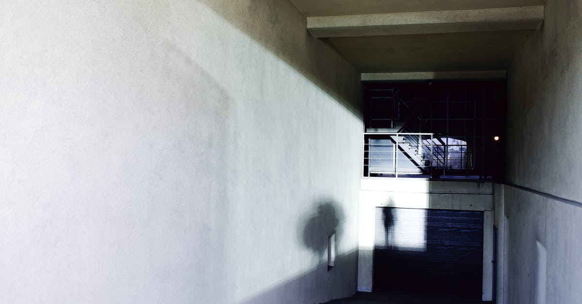 Is there any way to cast signs more quickly? - Anonymous person casting shadow on white wall of underground passage in city on sunny day