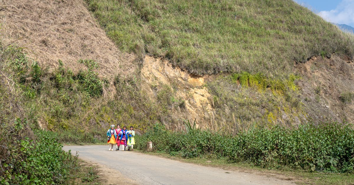 Is there any way to change the Item Route before you reach the 10th Floor Innocent town? - Group of local distant kids strolling on roadway between green bushes near grassy mountain while spending time in rural area Is there any way to change the Item Route before you reach the 10th Floor Innocent town? - Group of local distant kids strolling on roadway between green bushes near grassy mountain while spending time in rural area