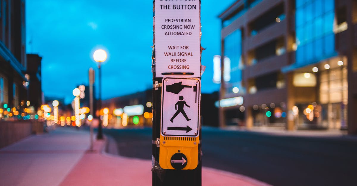 Is there any way to get rid of the 'infinity' button in Cookie Clicker? - Pedestrian call button on crosswalk in contemporary city in evening