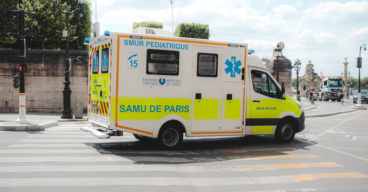 Is there any way to help Celina? - Ambulance driving along road in sunny city