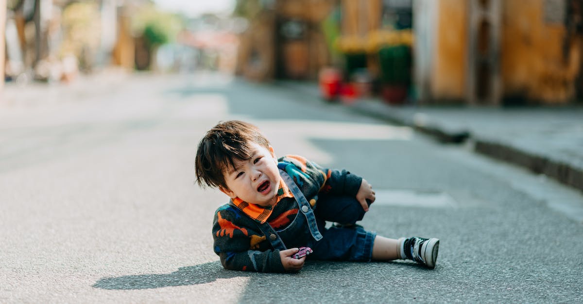 Is there any way to identify enemy vulnerabilities? - Crying Asian boy lying on road
