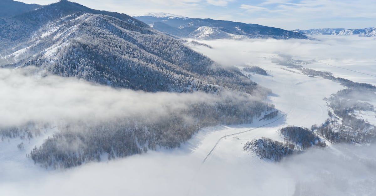Is there any way to keep my minecraft server from going through the day/night cycle when no one's online? - Drone view of snowy valley among mountains covered coniferous forest and road going between mountain ridge through clouds in sunny winter day Is there any way to keep my minecraft server from going through the day/night cycle when no one's online? - Drone view of snowy valley among mountains covered coniferous forest and road going between mountain ridge through clouds in sunny winter day