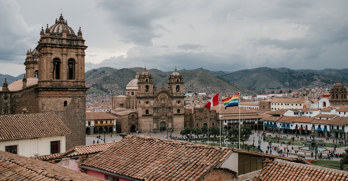 Is there any way to prevent sectors from building on a specific tile of a planet? - Cityscape of medieval church and houses with old tile roof in Cusco Peru