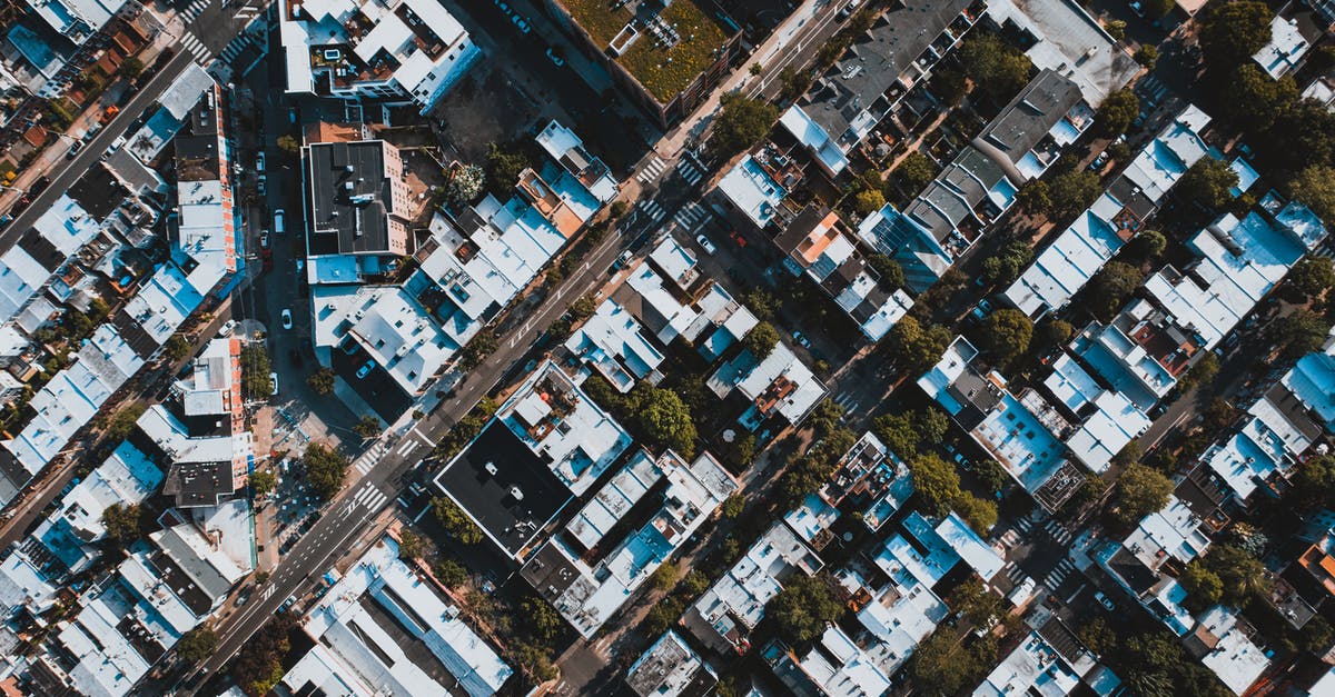 Is there any way to remotely disable a command block? - Area of residential district with roofs of buildings