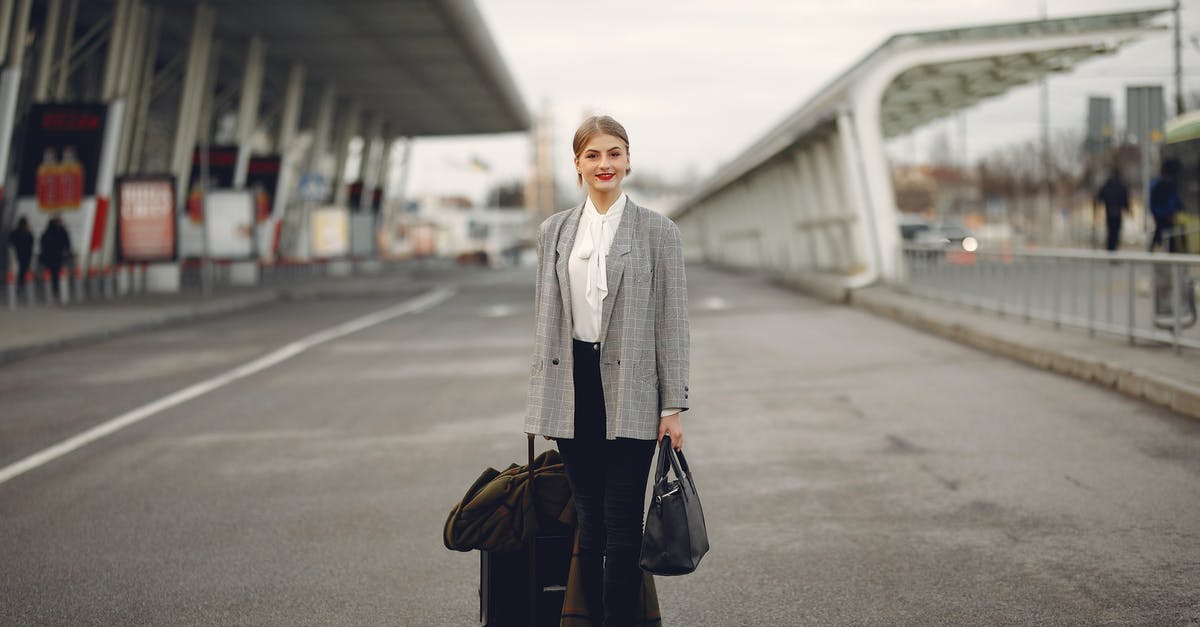 Is there anyway to leave a space station without your ship? - Happy female traveler walking on airport street with luggage Is there anyway to leave a space station without your ship? - Happy female traveler walking on airport street with luggage