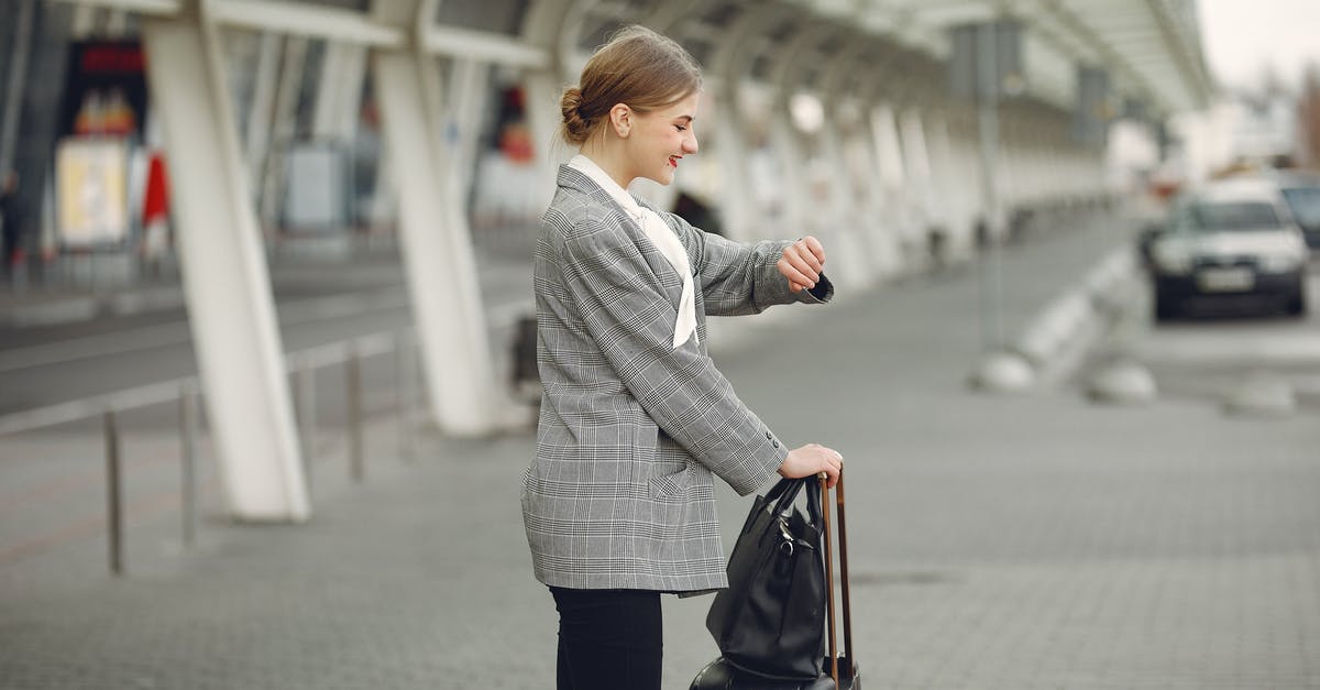 Is there anyway to leave a space station without your ship? - Cheerful female manager checking time on wristwatch standing with bags near bus station Is there anyway to leave a space station without your ship? - Cheerful female manager checking time on wristwatch standing with bags near bus station