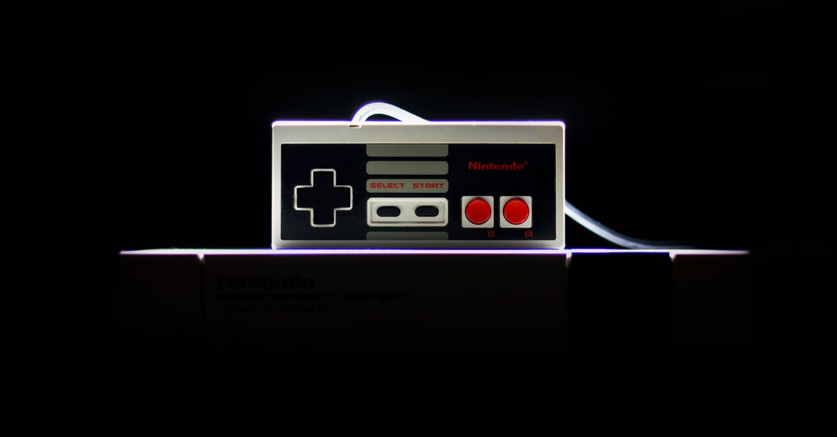Is there in-game differences between 3 and 5 screws NES games? - Low-light Photo Of Nes Controller