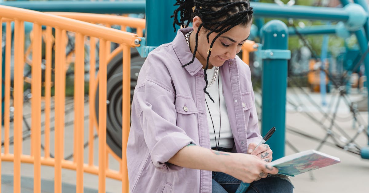 Is there such a genre where the main gameplay focuses on writing bots? - Woman Sitting with Notebook