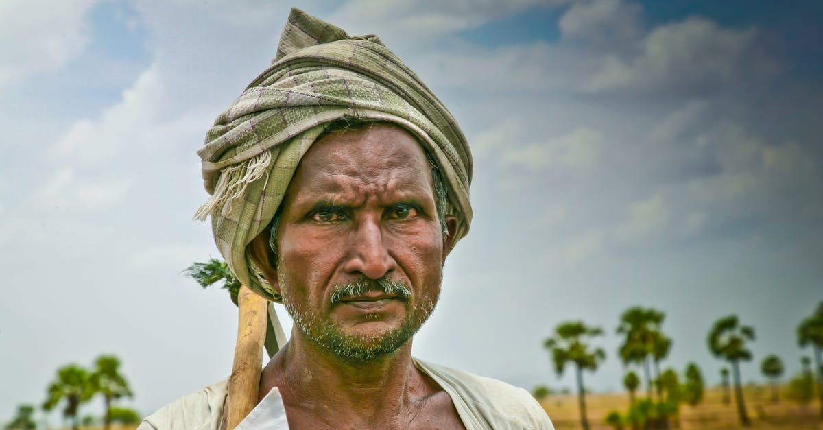 Is this villager a nitwit? - Close-Up Photo of a Man Wearing a Green Turban Is this villager a nitwit? - Close-Up Photo of a Man Wearing a Green Turban
