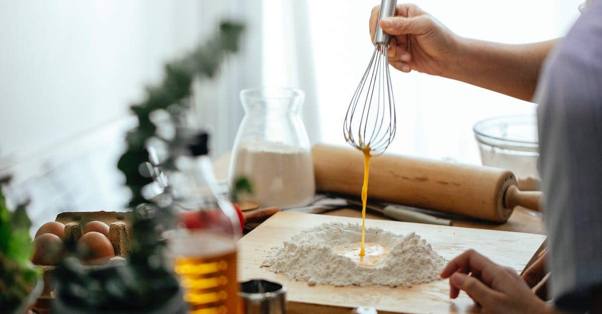 Is what is inside of an Egg Pre-Determined? - Crop cook with whisk preparing dough