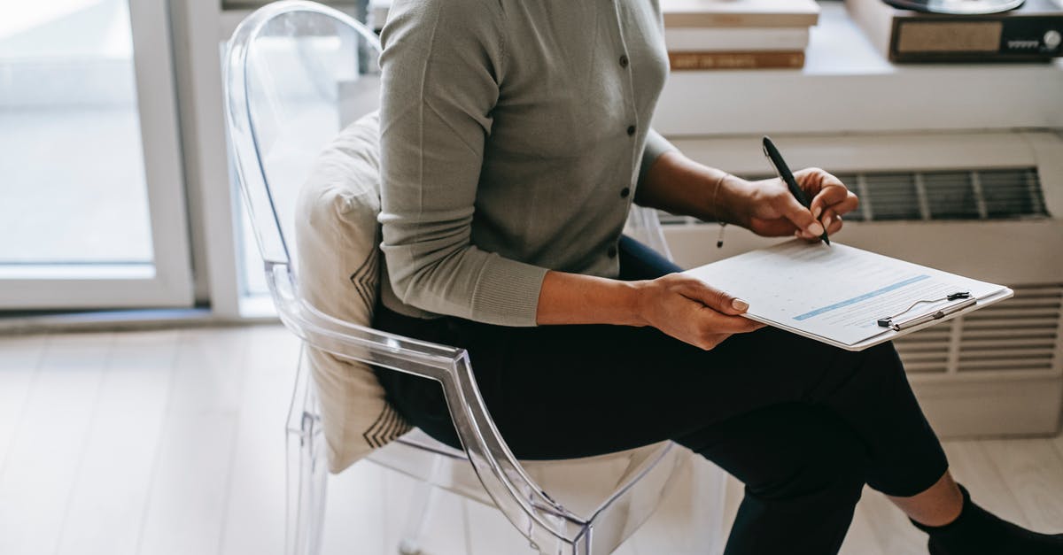 Issue with launching Rust from Steam (on Ubuntu 18.04) - From above of unrecognizable female psychologist with crossed legs taking notes on clipboard while filling out questionnaire during psychotherapy appointment in cozy office