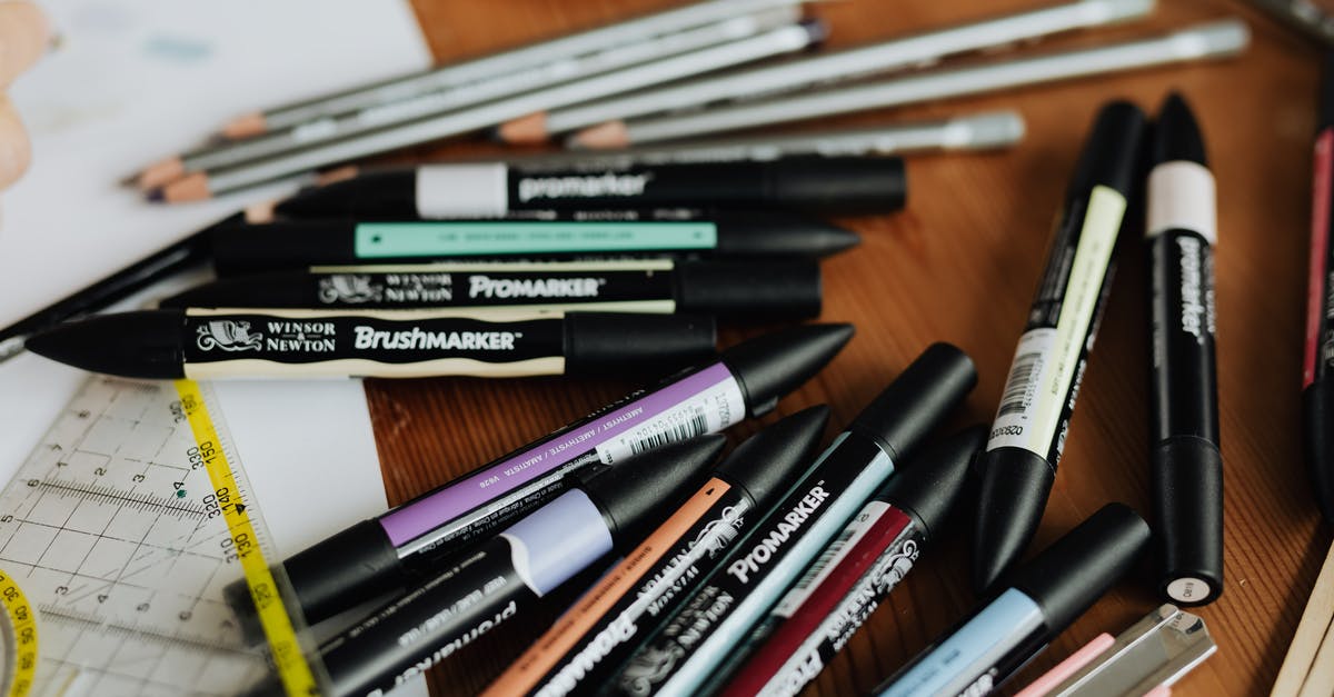Items disappearing from workshop? - Scattered stationery of colourful drawing markers and pencils on working table of architect