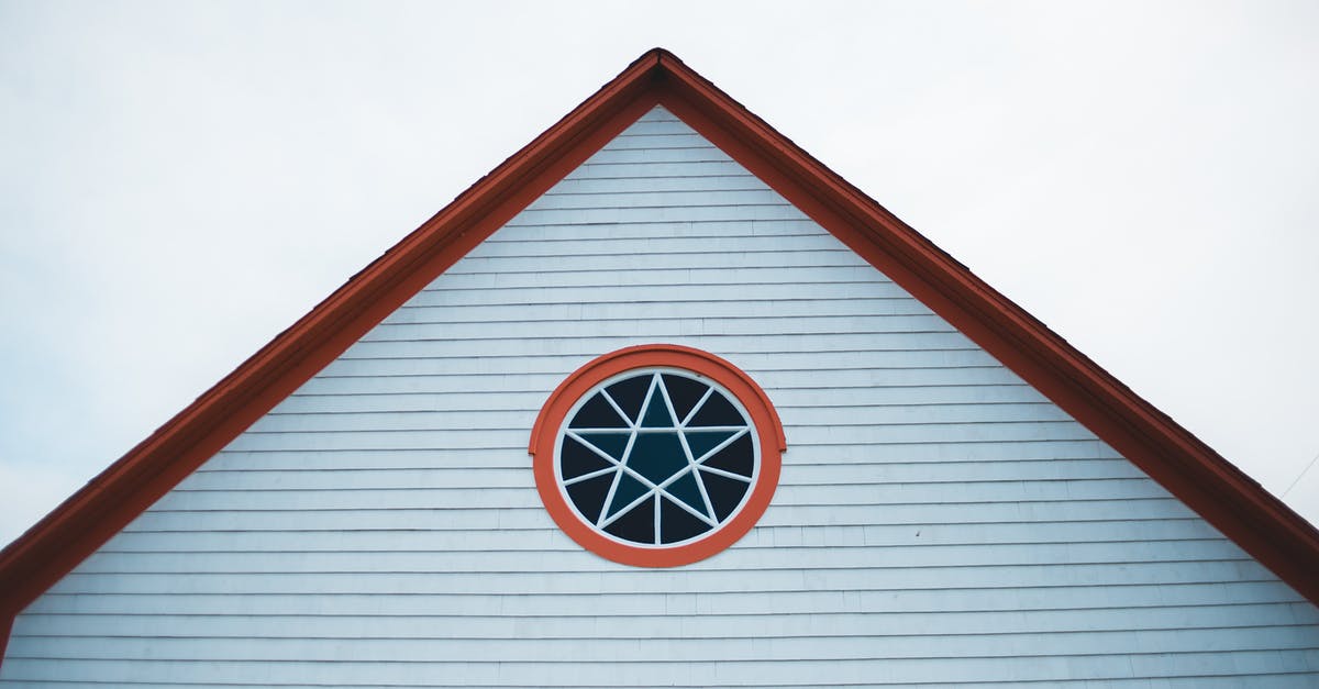 Jabba's Palace: Lego Star Wars the Complete Saga - From below roof and round window with star motif of aged historical house against cloudy sky in Green s Harbour