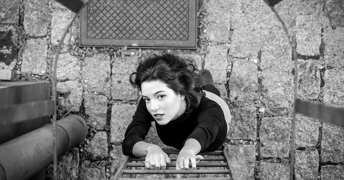 Jetpack turning on when I finish climbing a ladder on my rover? - Gray scale photo of a woman about to climb the fire escape ladder Jetpack turning on when I finish climbing a ladder on my rover? - Gray scale photo of a woman about to climb the fire escape ladder