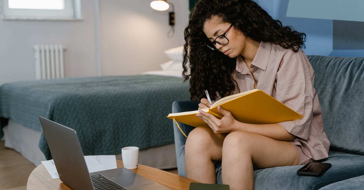 Key binding for separating storm not working - A Young Woman Writing in a Notebook While Sitting on a Couch Key binding for separating storm not working - A Young Woman Writing in a Notebook While Sitting on a Couch