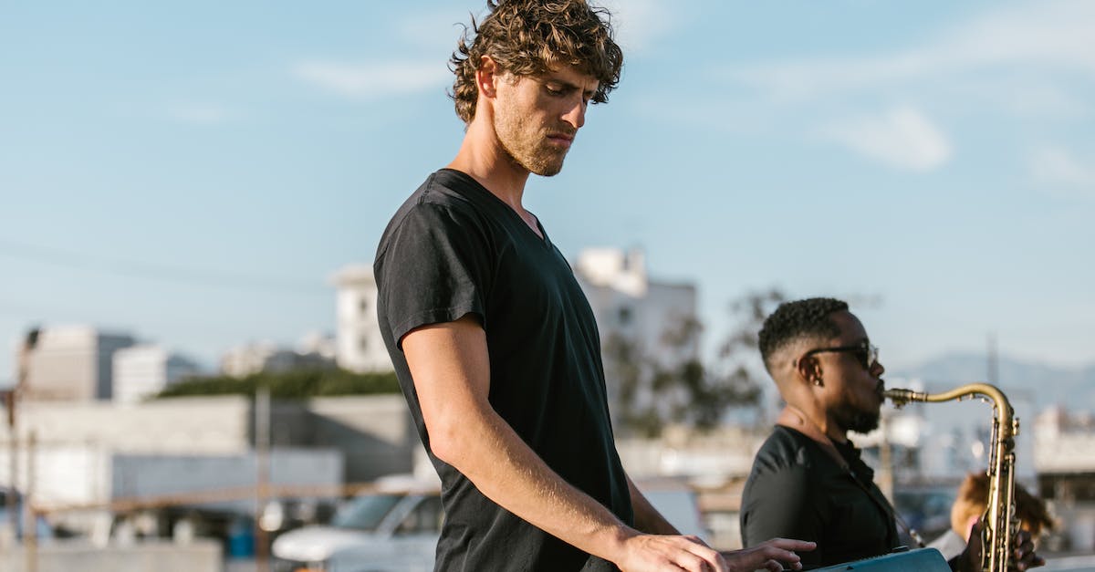 Keyboard issue with Batman Arkham Asylum - A Man in Black T-shirt Playing the Keyboard Beside a Man Playing the Saxophone Keyboard issue with Batman Arkham Asylum - A Man in Black T-shirt Playing the Keyboard Beside a Man Playing the Saxophone