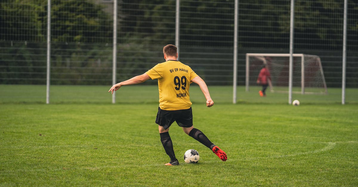 Knock a player off of a block - Boy in Yellow and Black Soccer Jersey Playing Soccer Knock a player off of a block - Boy in Yellow and Black Soccer Jersey Playing Soccer