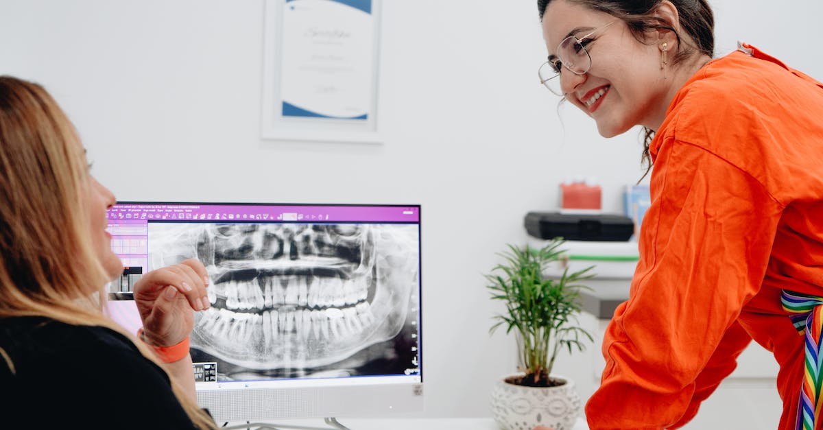 Knockback on Hit with Witch Doctor [duplicate] - Women Looking at a Dental X-ray on a Computer