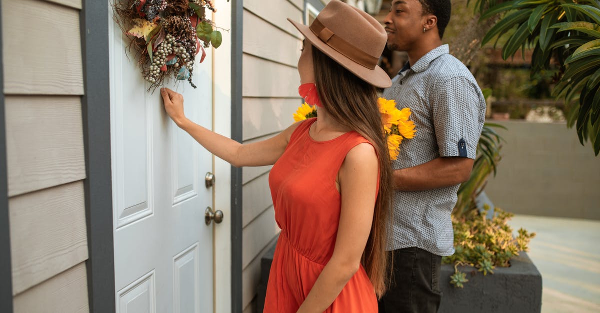 Knocking yourself out? - A Woman in Orange Dress Knocking on the Door