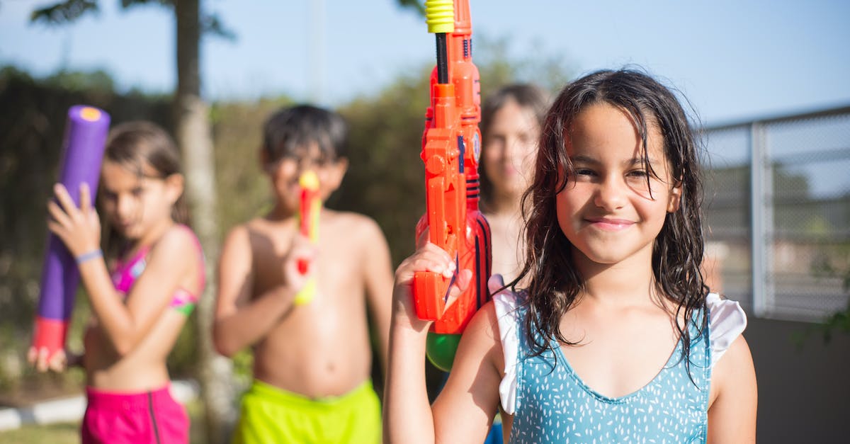 Lag when playing Rust - Girl in Blue Tank Top Holding Red Toy Gun