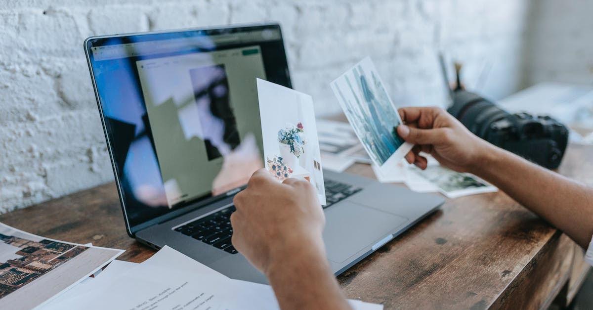 Leaping shot op in Online mode? - Crop unrecognizable man choosing photos and working on laptop Leaping shot op in Online mode? - Crop unrecognizable man choosing photos and working on laptop