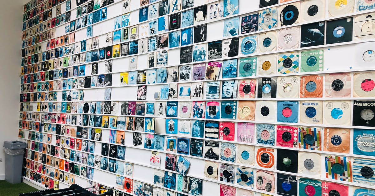 Legends of Eisenwald - where does the game store the savegames? - Vintage vinyl discs hanging on wall near foosball in store