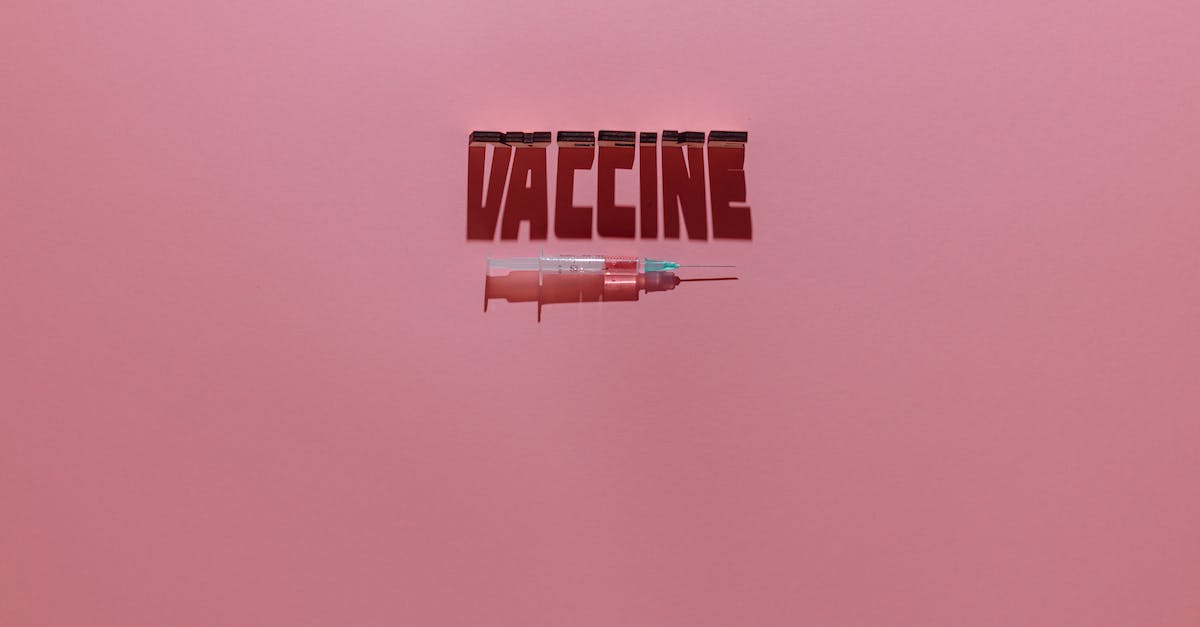 Level 2: "Four clever characters" - A Syringe and Vaccine Lettering Text on Pink Background Level 2: "Four clever characters" - A Syringe and Vaccine Lettering Text on Pink Background