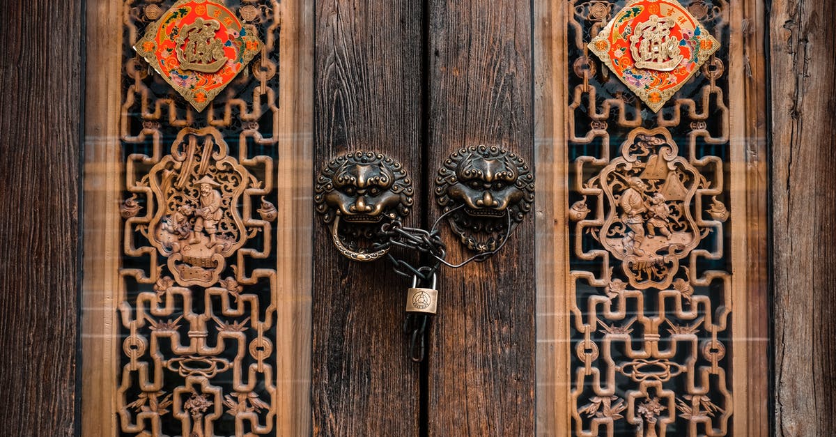 Locked doors in Vizima outskirts - Closed French Door With Padlock and Chain Locked doors in Vizima outskirts - Closed French Door With Padlock and Chain