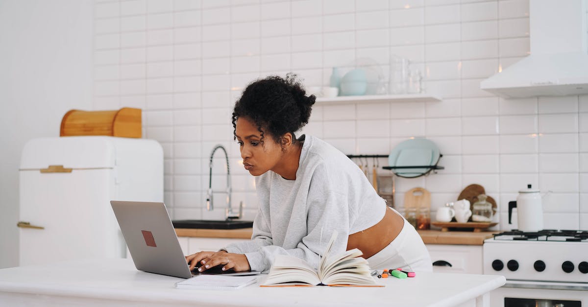Looking for a specific type of dual lane - A Woman in Gray Sweater Typing on Her Laptop Looking for a specific type of dual lane - A Woman in Gray Sweater Typing on Her Laptop