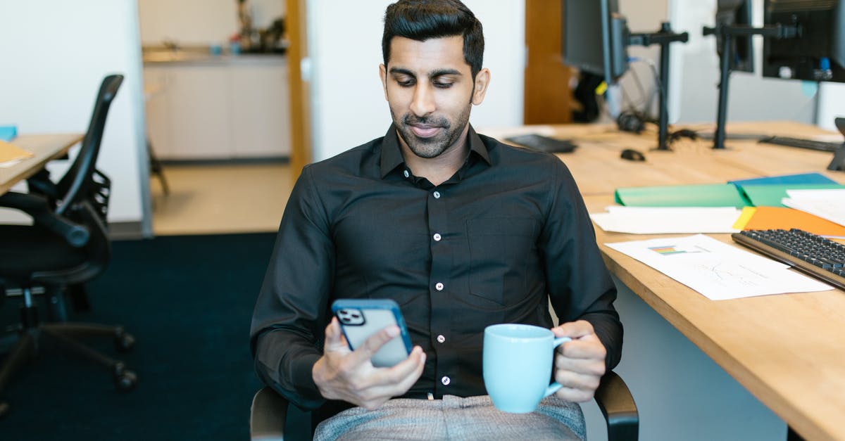 Looking for where addons are downloaded in files - Man in Black Dress Shirt Holding Blue Ceramic Mug Looking for where addons are downloaded in files - Man in Black Dress Shirt Holding Blue Ceramic Mug