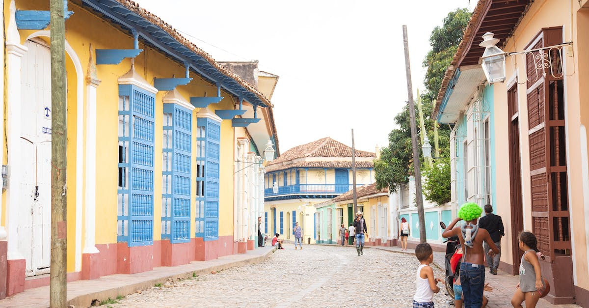 Luring CC troops out with dragon attack i.e. only have 200 housing space for troops - Unrecognizable ethnic children playing on street in town