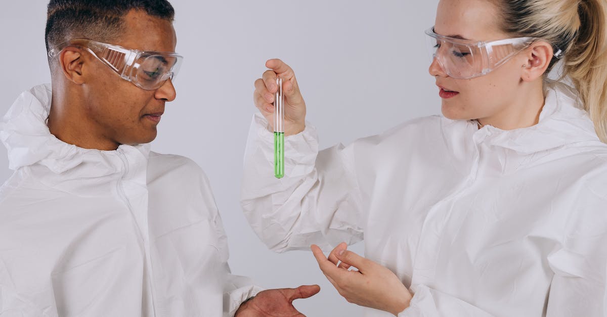 Mad Scientist Interaction with duplicate secrets - Man in White Dress Shirt Wearing Eyeglasses Mad Scientist Interaction with duplicate secrets - Man in White Dress Shirt Wearing Eyeglasses