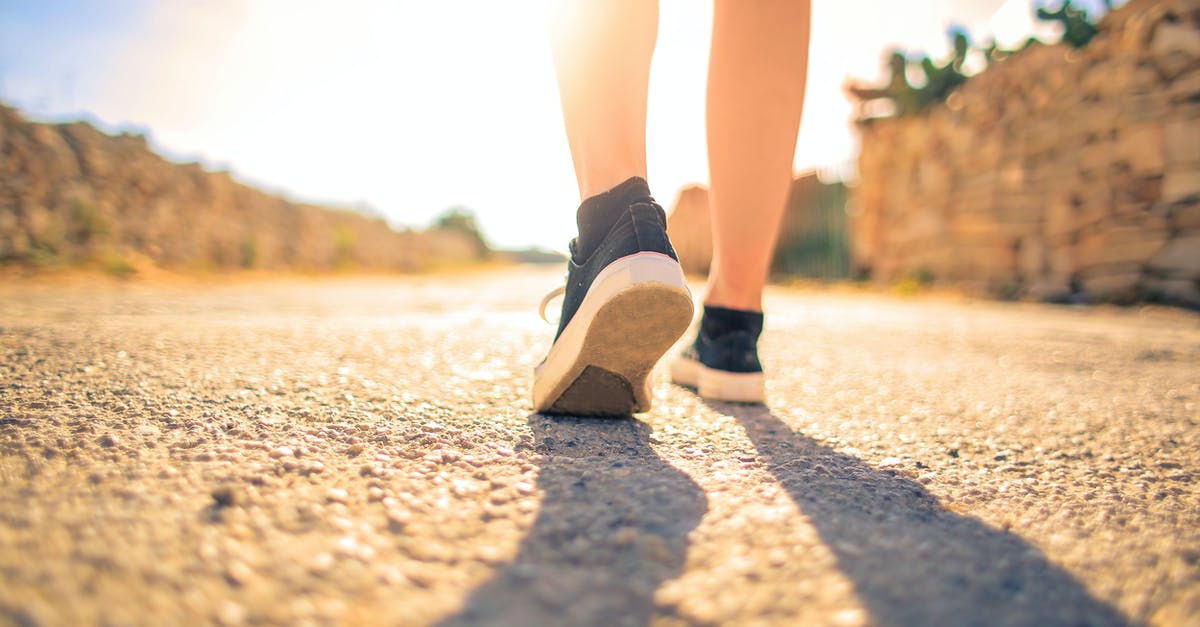 Make ground paths meet suspended paths - Woman Walking on Pathway Under The Sun