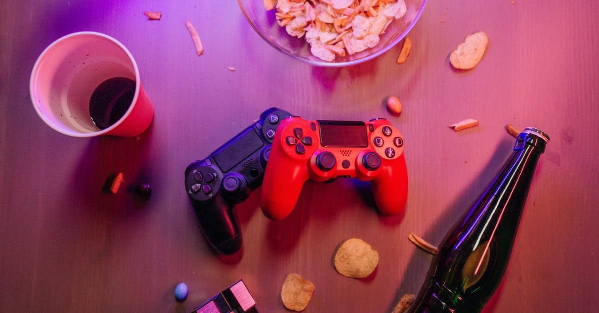 Making a PSN account on a friend's Playstation 4 - Messy Table with Game Controllers and a Beer Bottle Making a PSN account on a friend's Playstation 4 - Messy Table with Game Controllers and a Beer Bottle