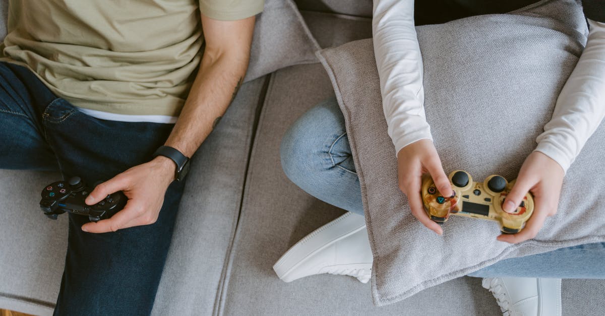 Making a second account in ps4 and playing games from other ps4 console - Close-Up Shot of Two People Playing a Video Game