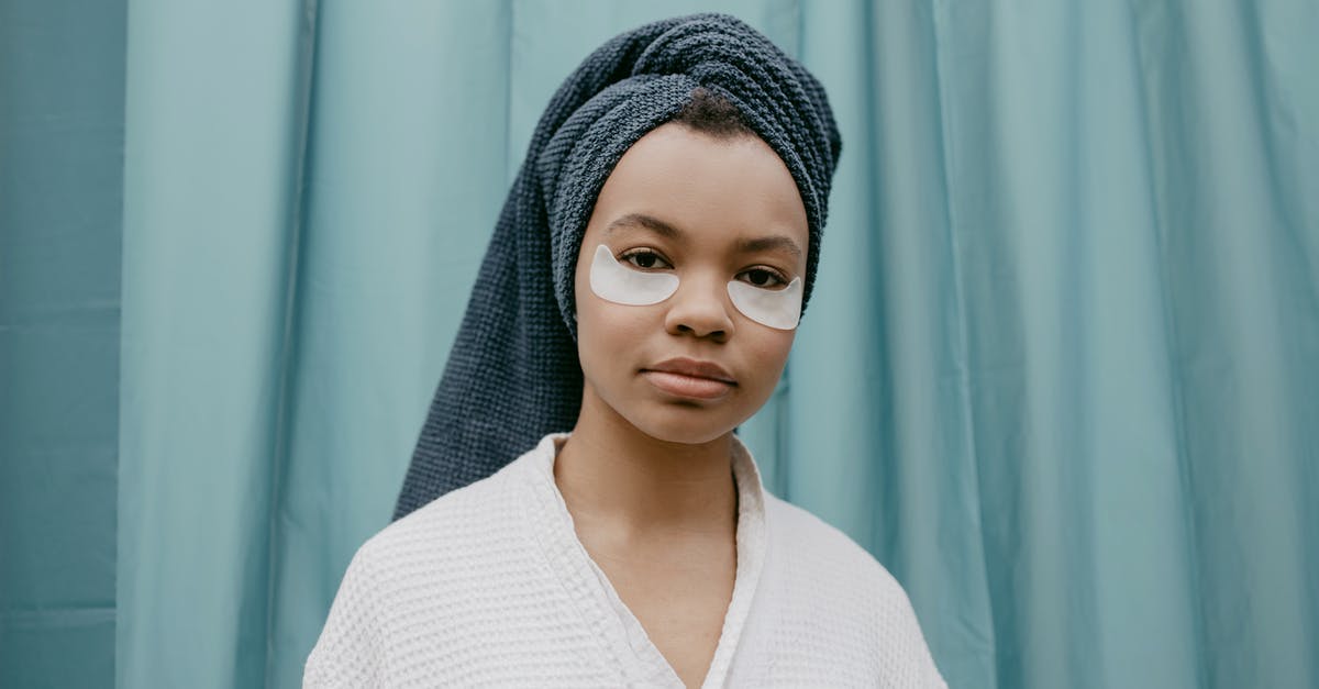 Mankar Camaron is wearing the Amulet of Kings - Woman in White Knit Sweater Wearing Gray Knit Cap Mankar Camaron is wearing the Amulet of Kings - Woman in White Knit Sweater Wearing Gray Knit Cap