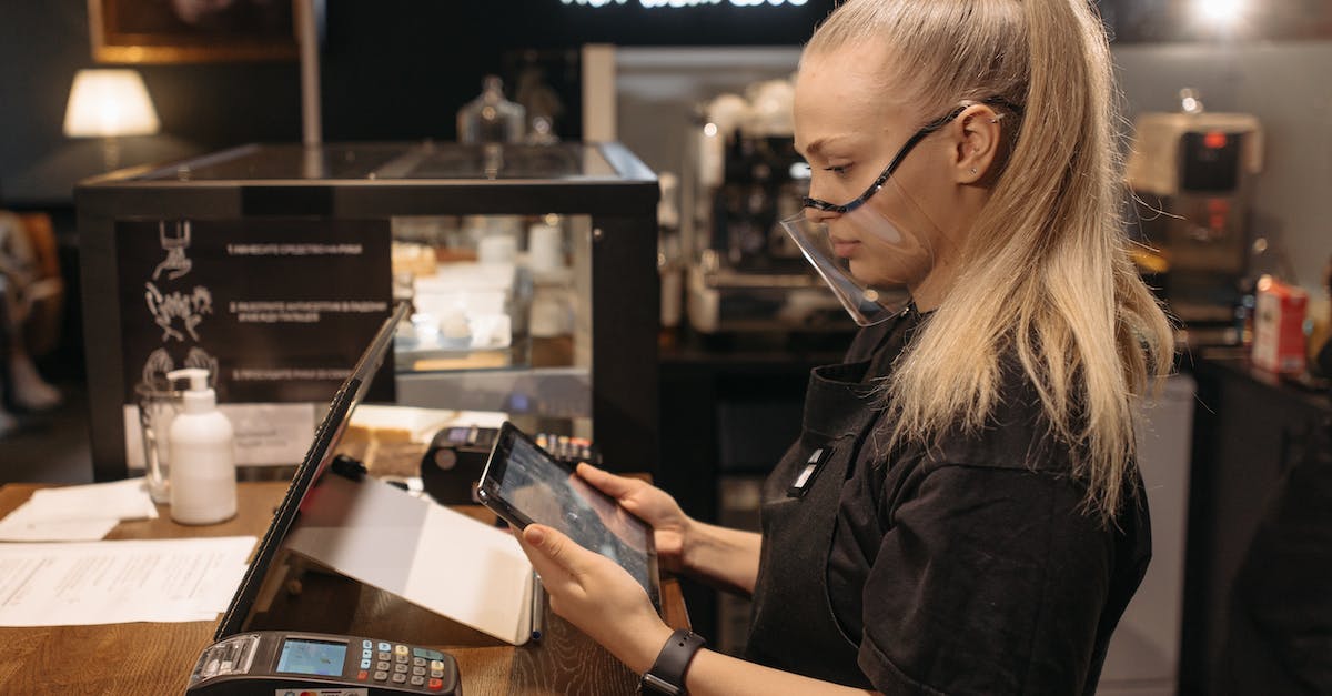 Mask of madness for Juggernaut - A Woman in Black Shirt with Clear Mask Holding a Tablet Mask of madness for Juggernaut - A Woman in Black Shirt with Clear Mask Holding a Tablet