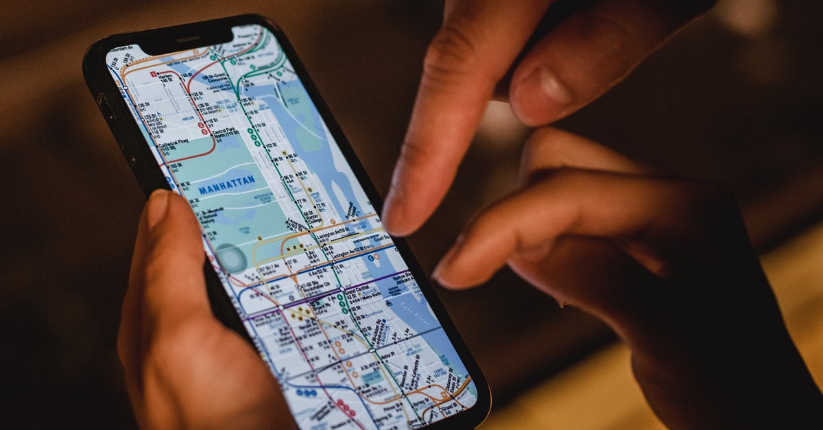 Mercer's Plans seem to appear outside of a map - Crop couple with map on smartphone Mercer's Plans seem to appear outside of a map - Crop couple with map on smartphone