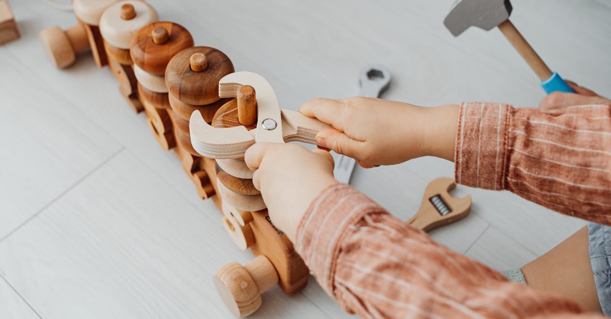 MH4u: Equipment for meowster hunters and stingers? - Person Holding Brown Wooden Toy MH4u: Equipment for meowster hunters and stingers? - Person Holding Brown Wooden Toy