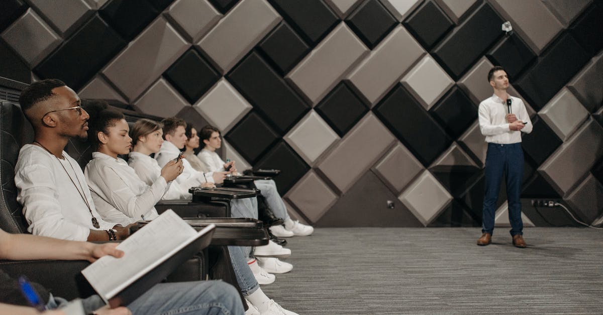 Microphone not working for team but works for group - Group of People Watching a Speaker Doing a Presentation