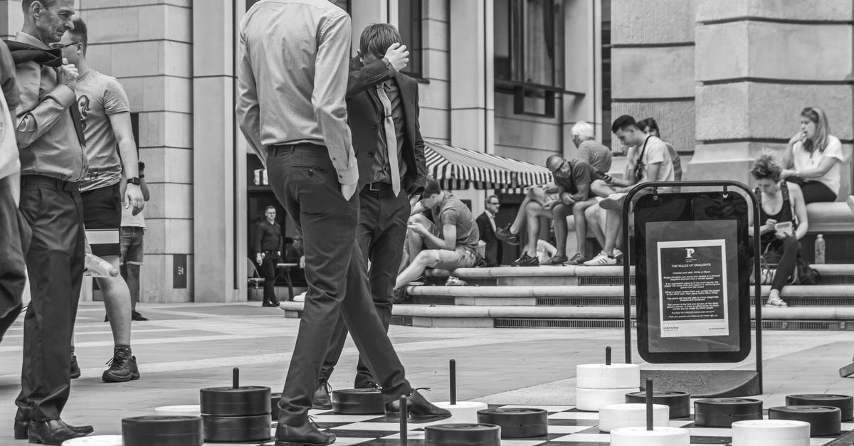 Micro-Stutters In All Games After Several Minutes Of Play - Men Standing on Oversized Chessboard