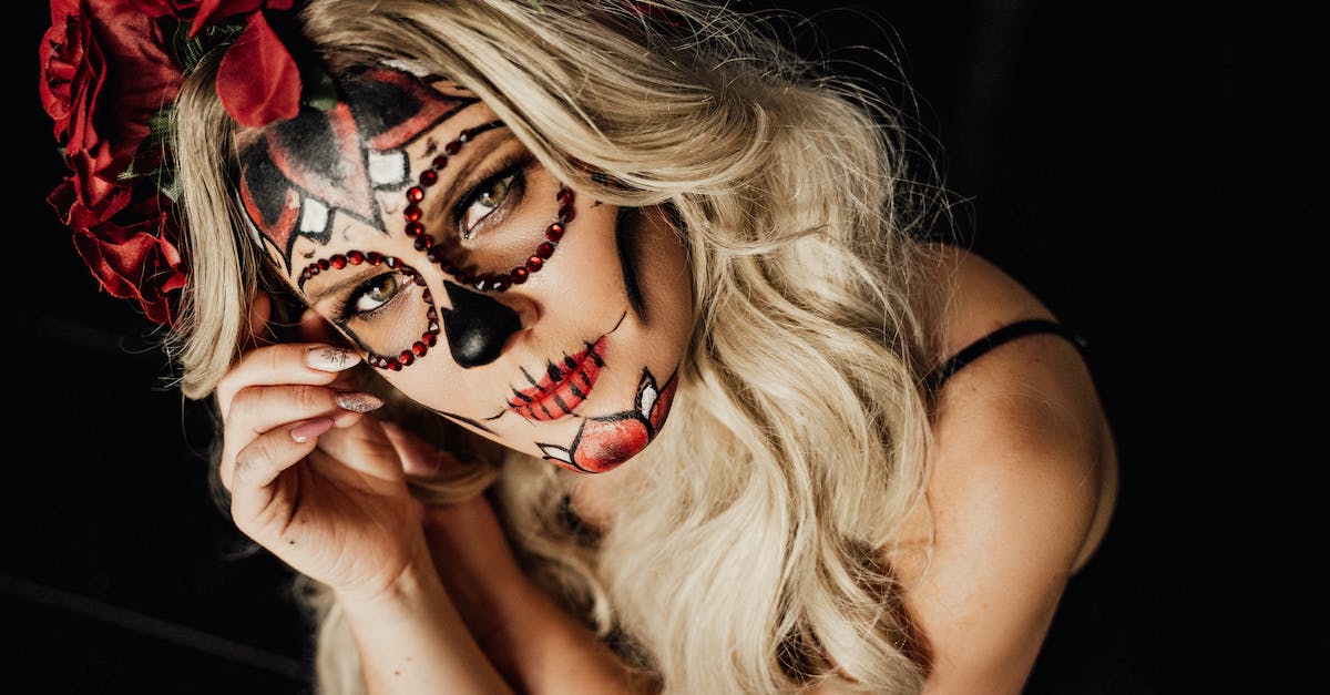 Migrate character from Xbox to Playstation - From above of feminine young lady with long blond hair and creative sugar skull makeup ad floral wreath looking at camera during celebration of Mexican Day of the Dead holiday Migrate character from Xbox to Playstation - From above of feminine young lady with long blond hair and creative sugar skull makeup ad floral wreath looking at camera during celebration of Mexican Day of the Dead holiday