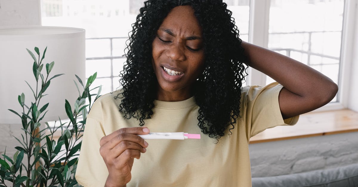 Minecraft 1.10.2 Problem: Expected token 'm' [duplicate] - Frustrated African American female in casual clothes looking at pregnancy test in hand while standing in light living room at home