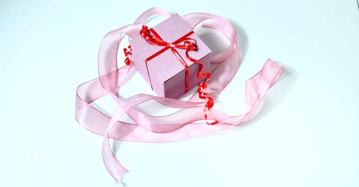 Minecraft Bow Command ./give multiple enchants [duplicate] - Present box decorated with red band and ribbon