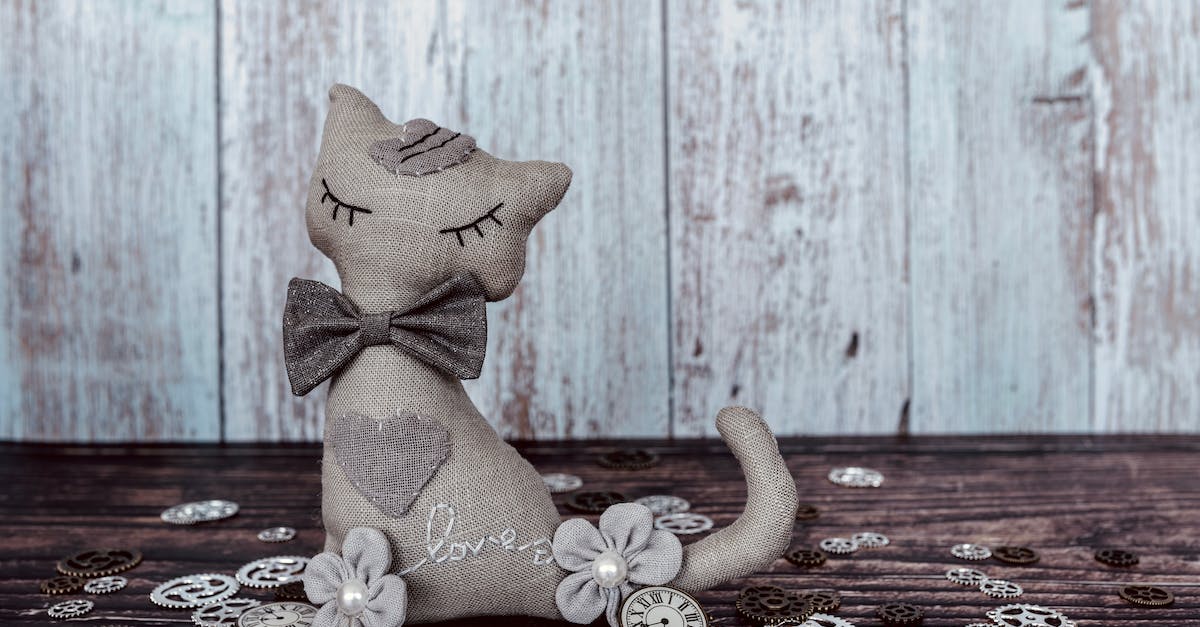 Minecraft Bow Enchanting / Modding -> Infinity - Brown Angel Figurine on Brown Wooden Table